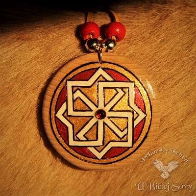 Slnečný symbol, metalický amulet